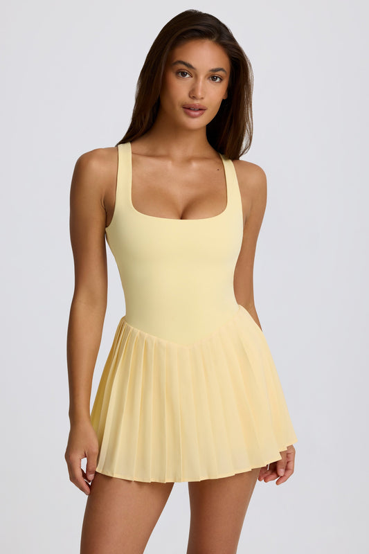 Soft Active Open-Back Pleated Tennis Dress in Lemon