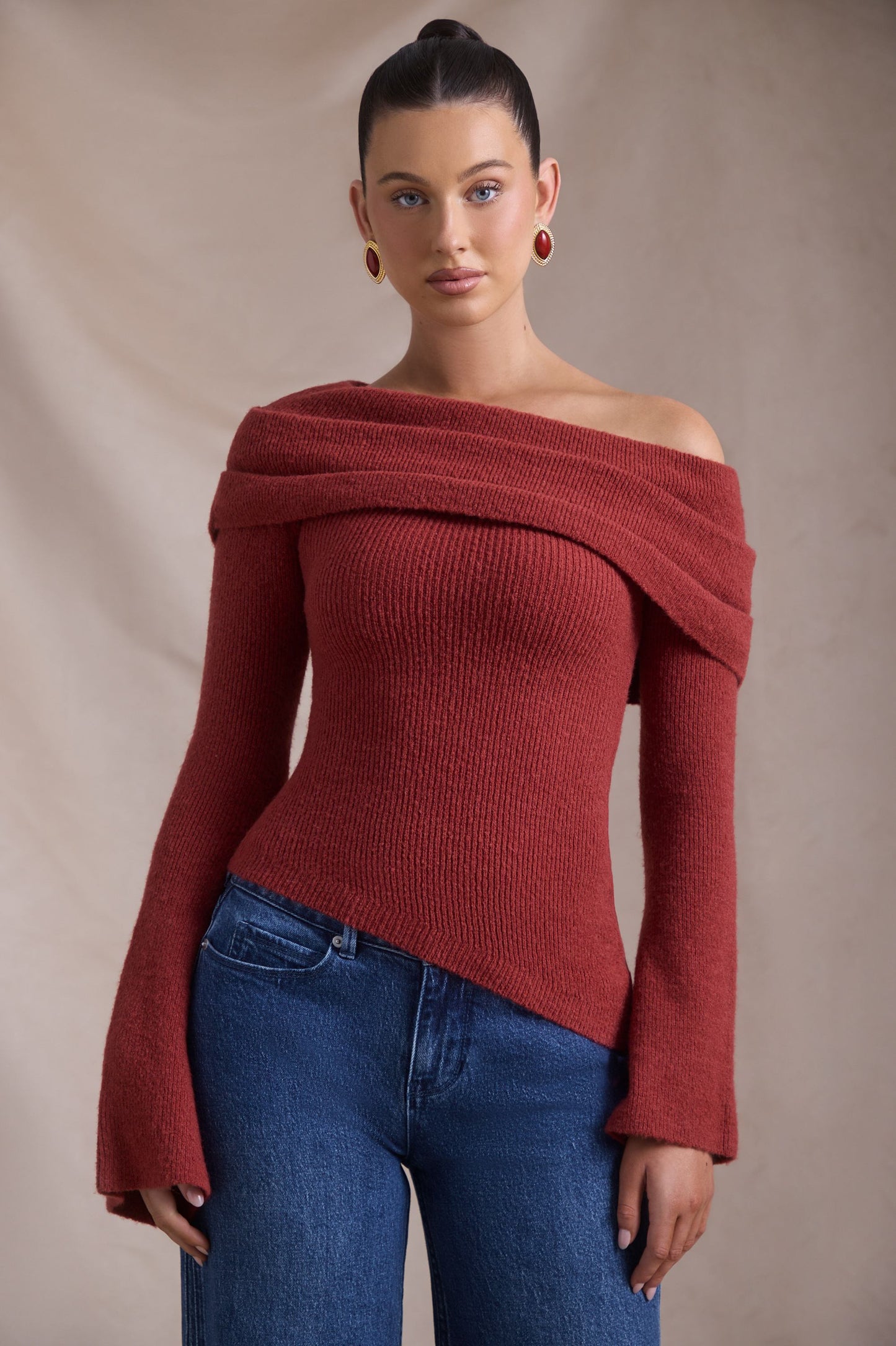 Ribbed-Knit Asymmetric Off-Shoulder Jumper in Brick Red